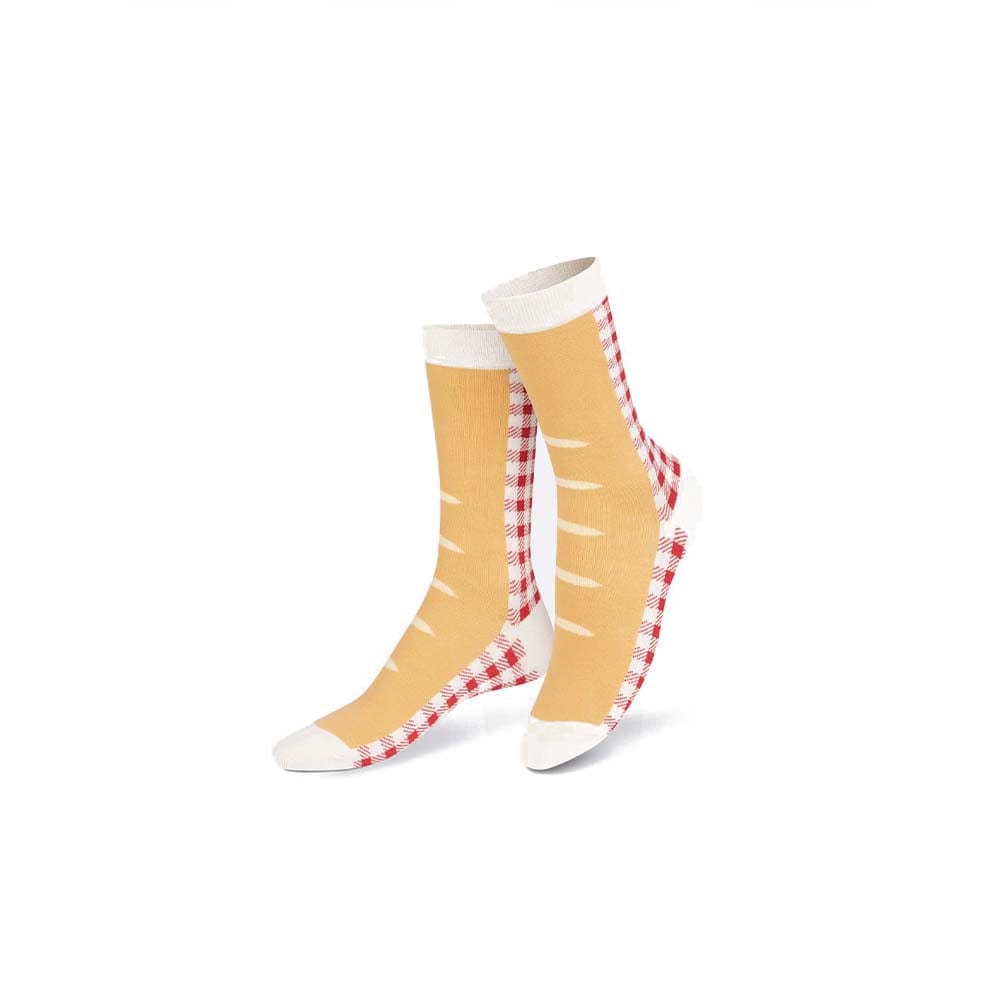 Découvrez l'originalité d'Eat My Socks avec des bas en forme de baguette. Un hommage à la boulangerie française, une expérience mode amusante et décalée.
