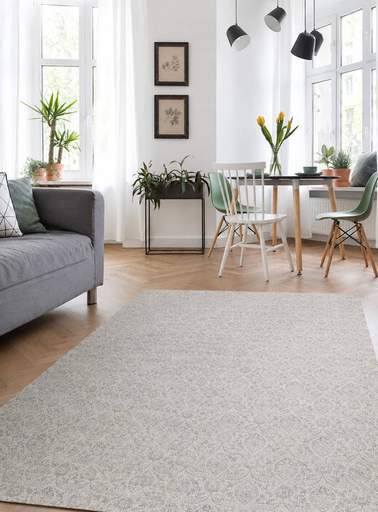 Tapis Agra d'Adama Alma, en vinyle gris antidérapant au design sobre et polyvalent pour tous les intérieurs.