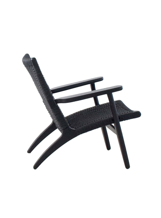 Fauteuil Cavo, touche chaleureuse et artisanale pour votre salon. noir