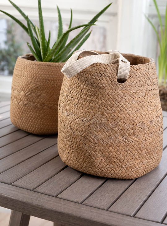 Cache-pot en ciment Enea avec effet tissé et lanière, design élégant pour plantes.
