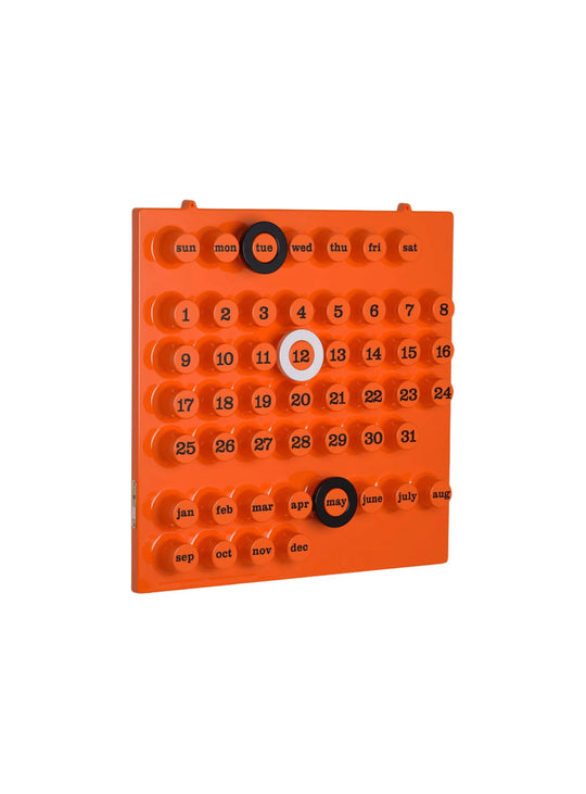 Calendrier perpétuel Ring-A-Date d'Euroway, un objet culte du design italien autrefois exposé au MoMA. orange