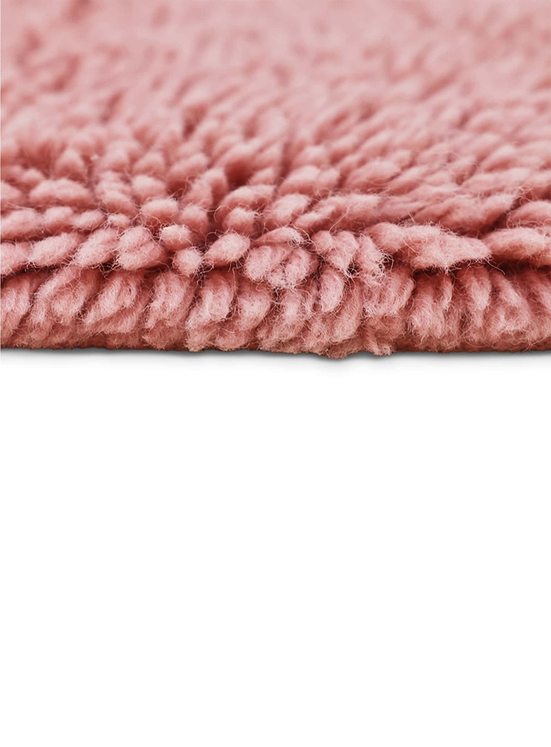 Tapis Fluffy rose HKliving : un tapis design en laine au charme poudré élégant.
