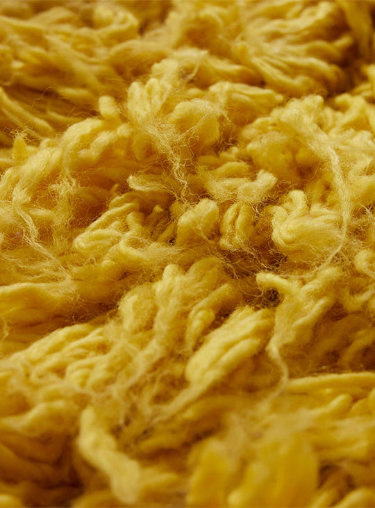 Tapis Fluffy jaune HKliving : douceur enveloppante et style audacieux contemporain.