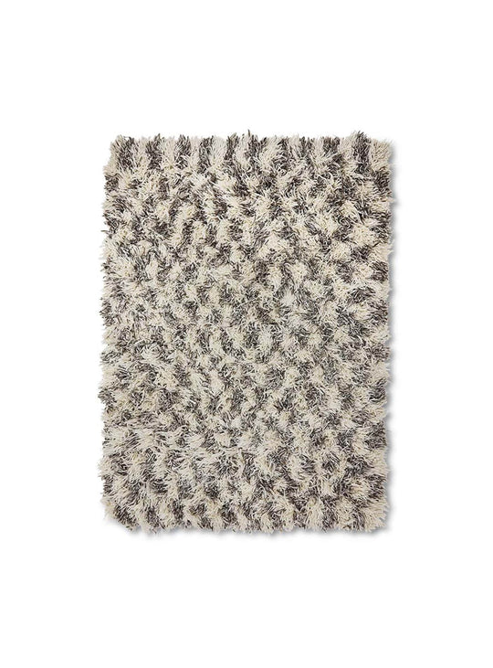 Tapis Shaggy HKliving : l'alliance parfaite entre design graphique et confort chaleureux.