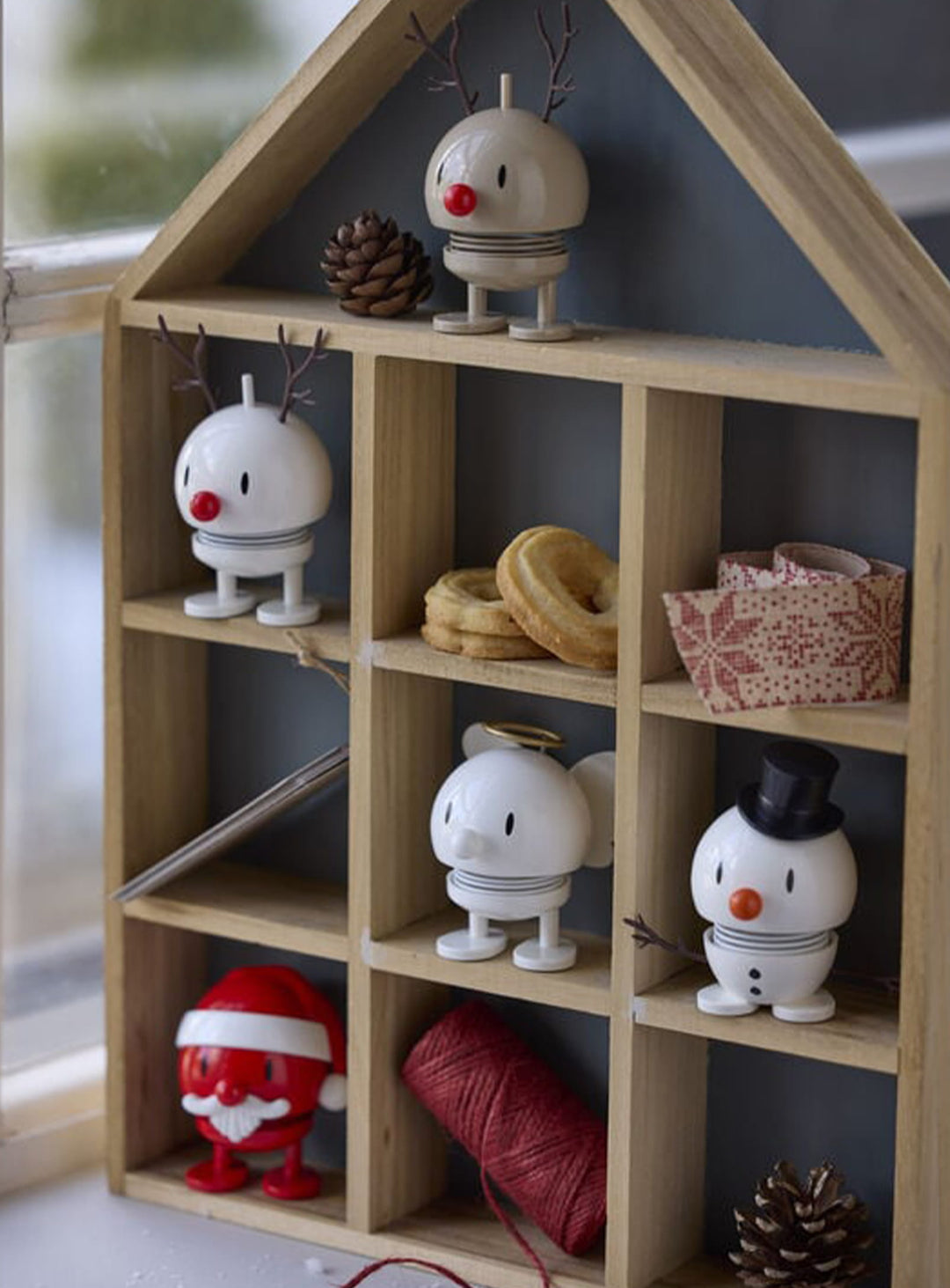 Figurine Bonhomme de neige Hoptimist, un petit personnage de Noël qui oscille doucement au moindre effleurement.
