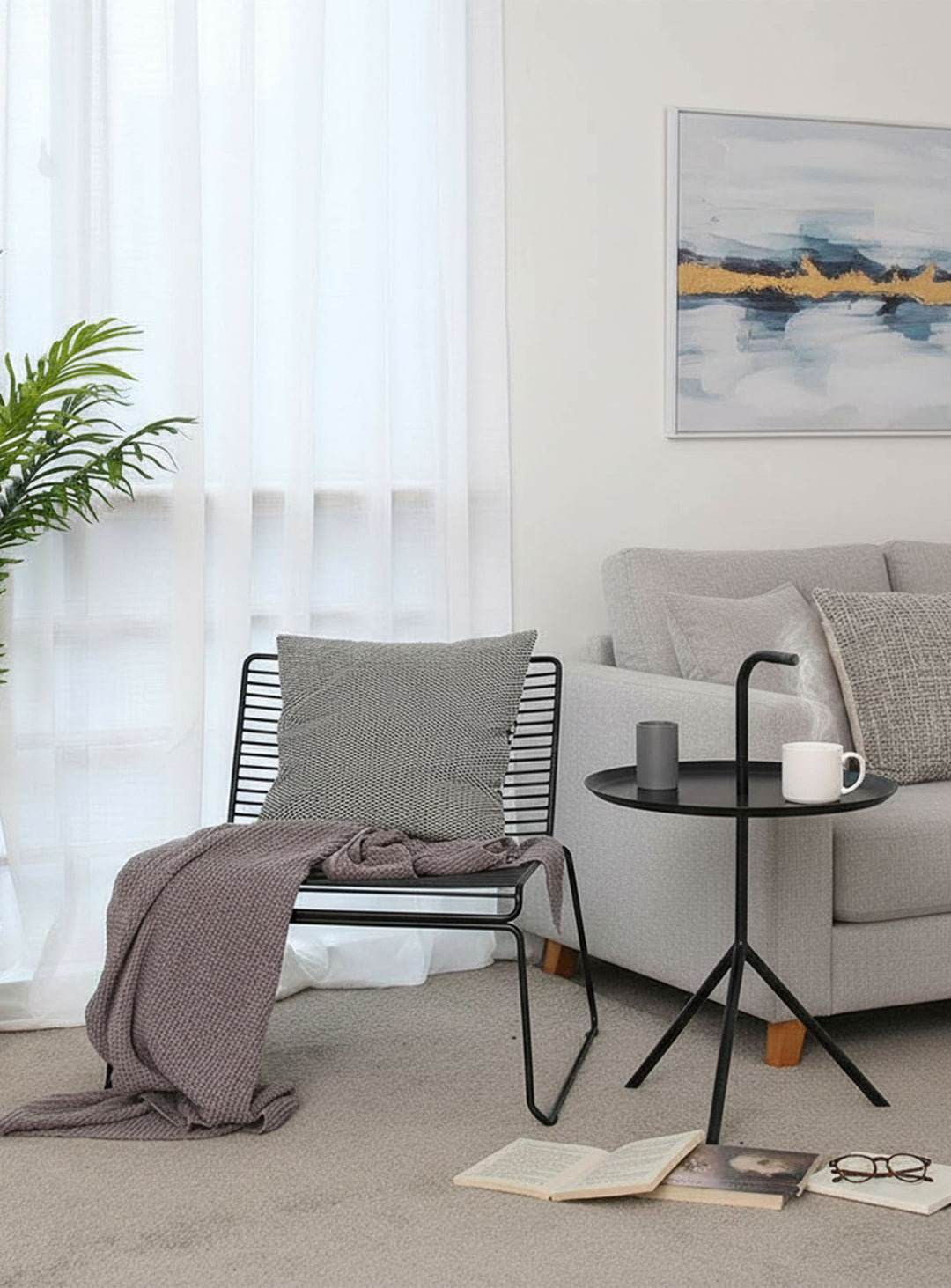 Table d’appoint Leave : design léger, acier laqué et poignée pratique. noir