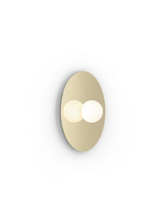 Applique Bola Disc Flush Pablo Designs, une pièce lumineuse au design épuré et à l’intensité réglable. laiton