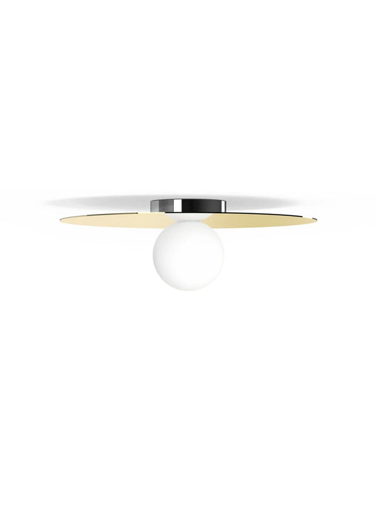 Applique Bola Disc Flush Pablo Designs, une pièce décorative au design circulaire et aux finitions raffinées. laiton