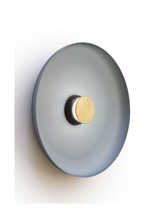 Applique murale Totem Pablo Designs : une création contemporaine au halo lumineux élégant.