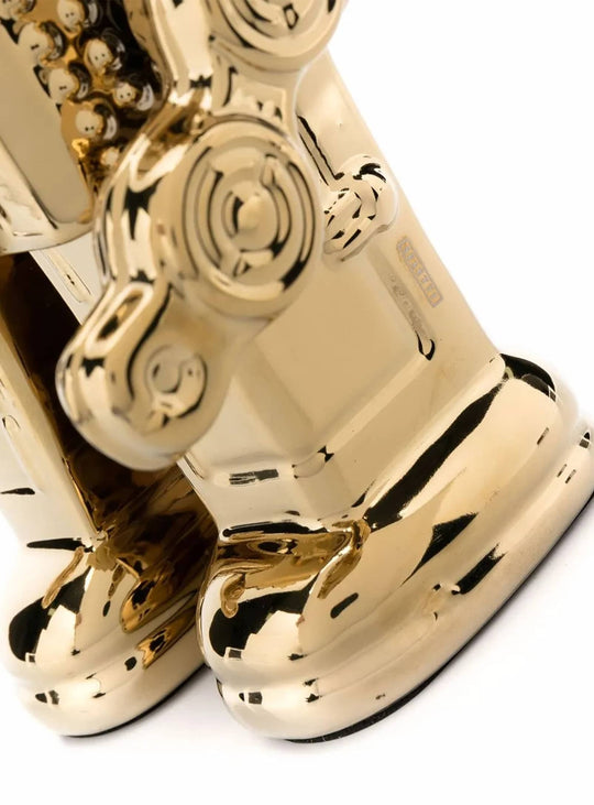 Statue My Robot Seletti : une création en porcelaine au style rétro intemporel. or