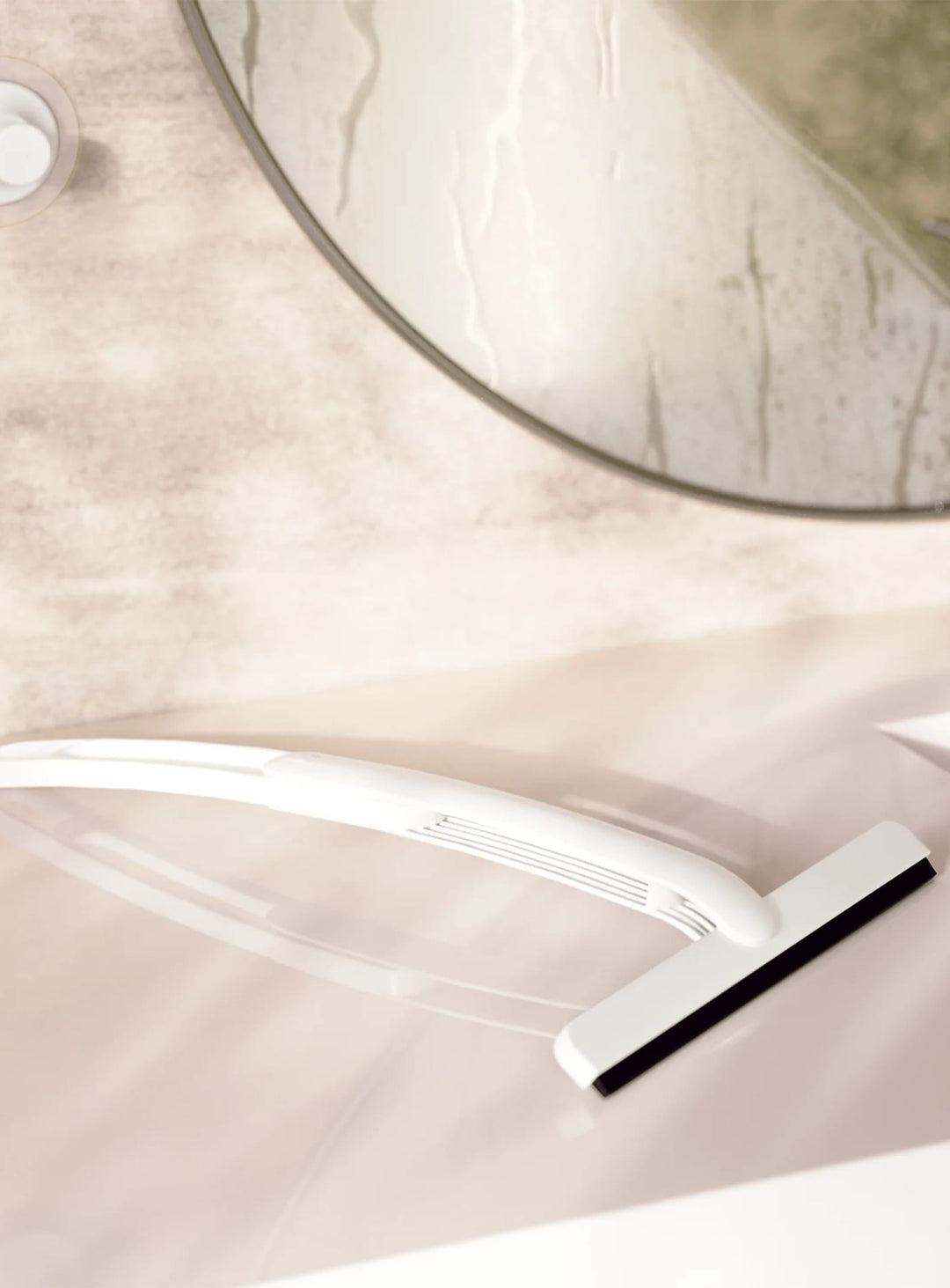 Raclette Flex Adhesive d'Umbra avec manche télescopique, lame flexible et support mural sans perçage.
