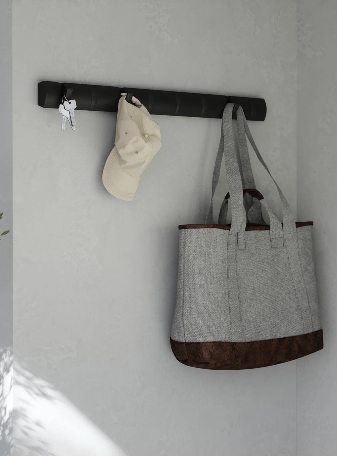 Crochets muraux Flip 8 Umbra : porte-manteaux design noir, 8 crochets rabattables. noir