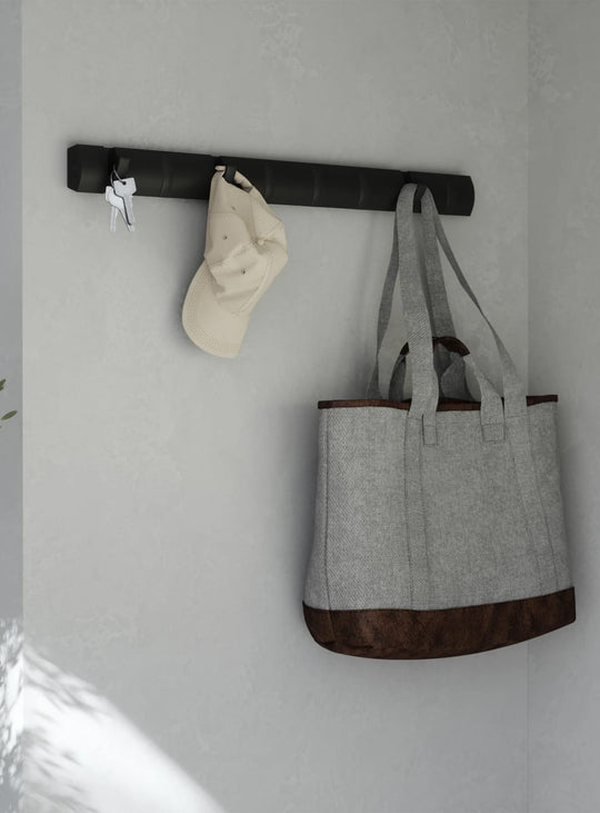 Crochets muraux Flip 8 Umbra : porte-manteaux design noir, 8 crochets rabattables. noir