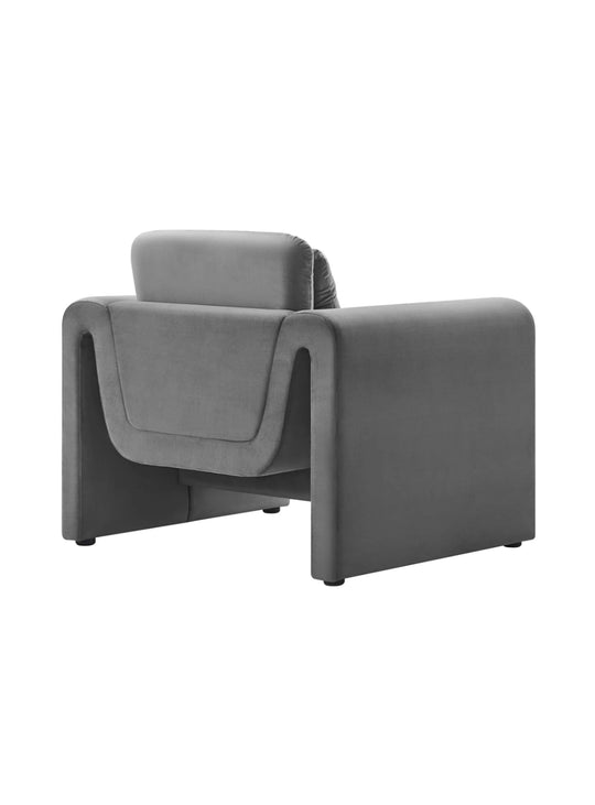 Le fauteuil Waverly allie formes ondulées et assise douillette. gris