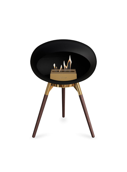 Foyer Le Feu Ground Low Dome noir : design danois et ambiance cosy.