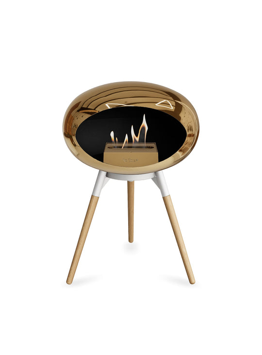 Foyer design Ground Low Dome or rose Le Feu : chaleur douce et allure chic.