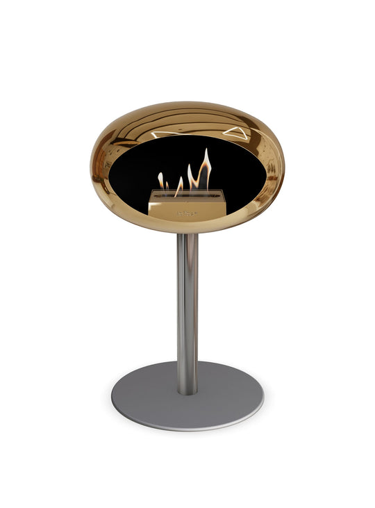 Le Feu Low Dome en or rose : cheminée autoportante douce et moderne.